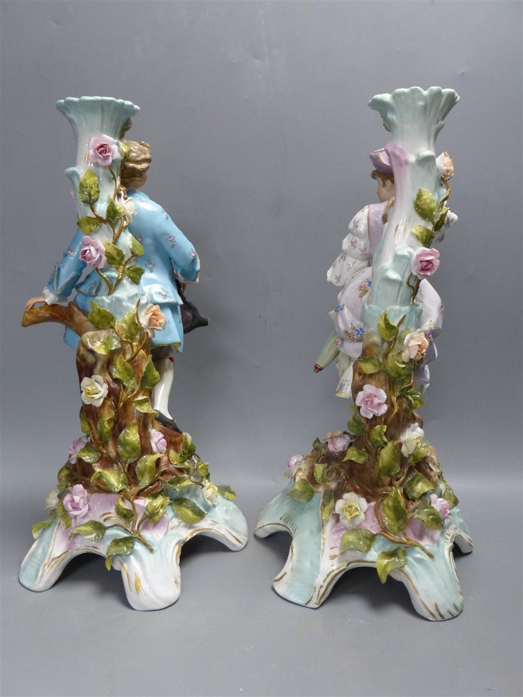 A pair of early 20th century Plaue porcelain figural candelabra, overall height 48cm